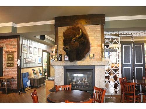 129 3 Avenue Sw, High River, AB - Indoor Photo Showing Living Room With Fireplace