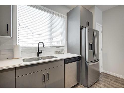 506-850 Belmont Drive Sw, Calgary, AB - Indoor Photo Showing Kitchen With Double Sink