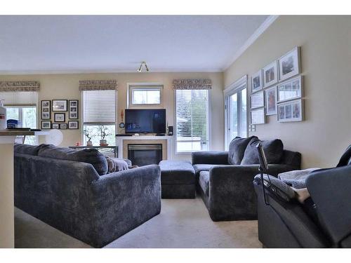 87 Edgeridge Terrace Nw, Calgary, AB - Indoor Photo Showing Living Room With Fireplace