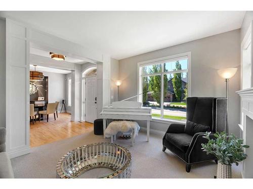 8 Discovery Valley Cove Sw, Calgary, AB - Indoor Photo Showing Living Room With Fireplace