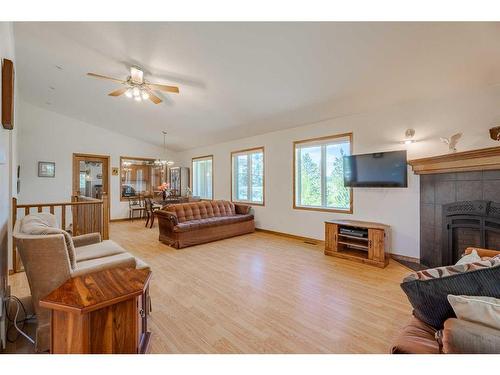 275052 Range Road 23, Rural Rocky View County, AB - Indoor Photo Showing Living Room With Fireplace