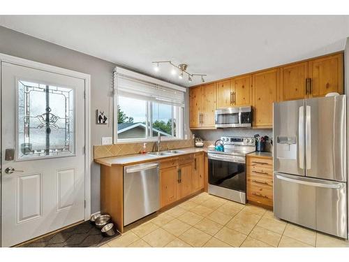 201 Acacia Drive Se, Airdrie, AB - Indoor Photo Showing Kitchen With Double Sink