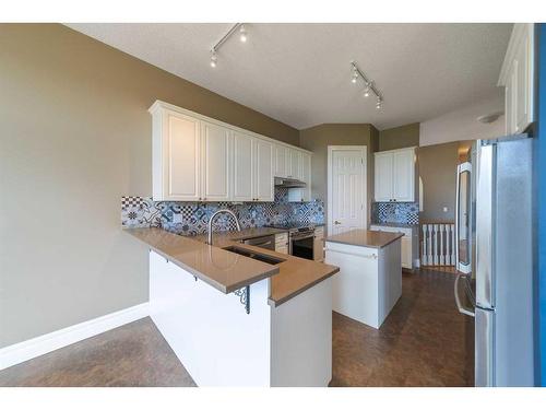 202 Patterson Boulevard Sw, Calgary, AB - Indoor Photo Showing Kitchen With Double Sink