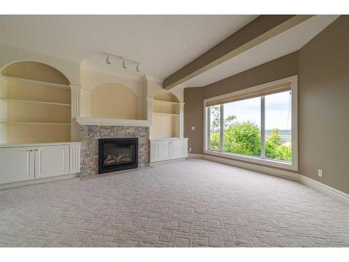 202 Patterson Boulevard Sw, Calgary, AB - Indoor Photo Showing Living Room With Fireplace