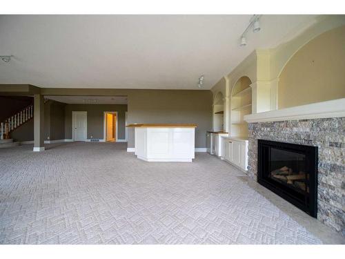 202 Patterson Boulevard Sw, Calgary, AB - Indoor Photo Showing Living Room With Fireplace