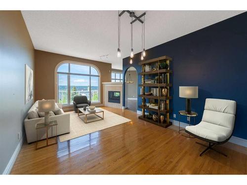 202 Patterson Boulevard Sw, Calgary, AB - Indoor Photo Showing Other Room With Fireplace