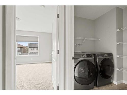 106 Magnolia Square Se, Calgary, AB - Indoor Photo Showing Laundry Room