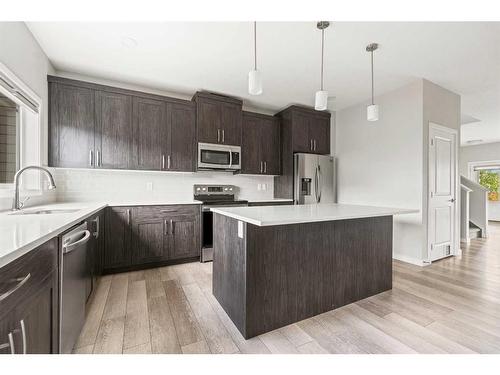 106 Magnolia Square Se, Calgary, AB - Indoor Photo Showing Kitchen With Stainless Steel Kitchen With Upgraded Kitchen