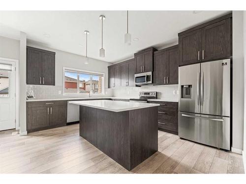 106 Magnolia Square Se, Calgary, AB - Indoor Photo Showing Kitchen With Stainless Steel Kitchen With Upgraded Kitchen