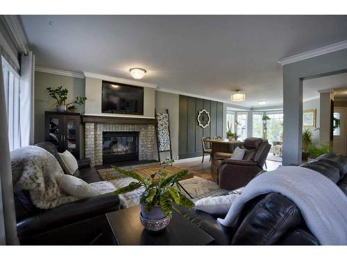 201 Riverwood Close Se, Calgary, AB - Indoor Photo Showing Living Room With Fireplace