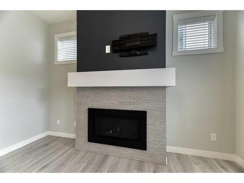 1217 Copperfield Boulevard Se, Calgary, AB - Indoor Photo Showing Living Room With Fireplace