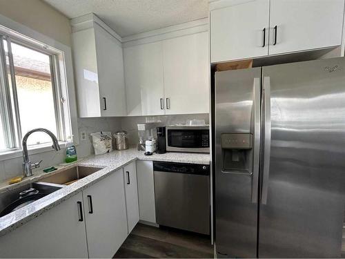 9 Erin Grove Court Se, Calgary, AB - Indoor Photo Showing Kitchen With Double Sink With Upgraded Kitchen