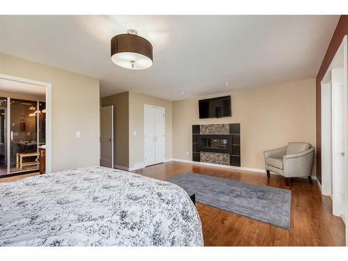 34456 Range Road 23, Rural Red Deer County, AB - Indoor Photo Showing Bedroom With Fireplace