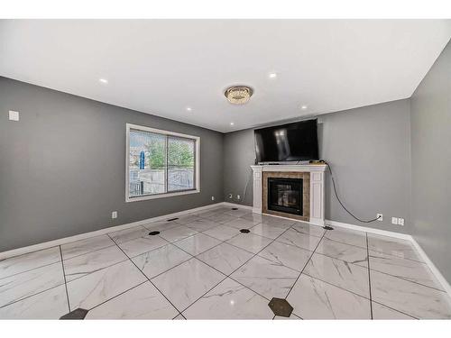 808 Luxstone Square Sw, Airdrie, AB - Indoor With Fireplace