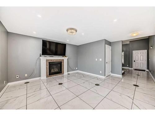 808 Luxstone Square Sw, Airdrie, AB - Indoor With Fireplace
