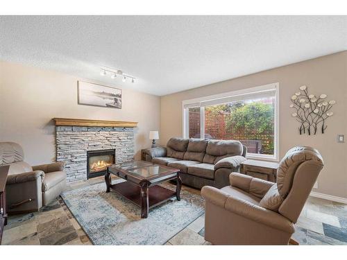 129 Schooner Close Nw, Calgary, AB - Indoor Photo Showing Living Room With Fireplace