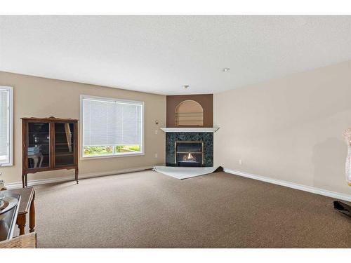 16-31222 Rge Rd 20A, Rural Mountain View County, AB - Indoor Photo Showing Living Room With Fireplace