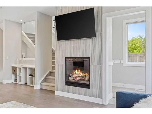 2050 49 Avenue Sw, Calgary, AB - Indoor Photo Showing Living Room With Fireplace