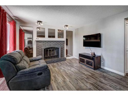 3 Scenic Glen Gate Nw, Calgary, AB - Indoor Photo Showing Living Room With Fireplace
