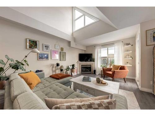 306-1631 28 Avenue Sw, Calgary, AB - Indoor Photo Showing Living Room With Fireplace