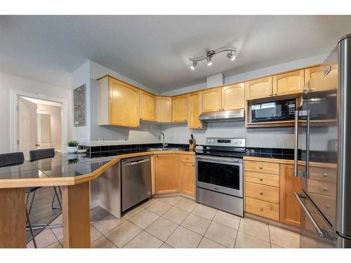 306-1631 28 Avenue Sw, Calgary, AB - Indoor Photo Showing Kitchen With Stainless Steel Kitchen