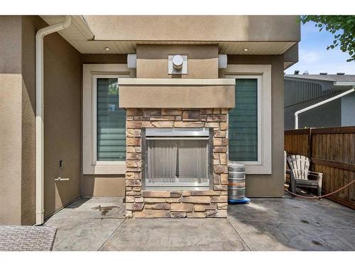 609 54 Avenue Sw, Calgary, AB - Outdoor With Fireplace With Exterior