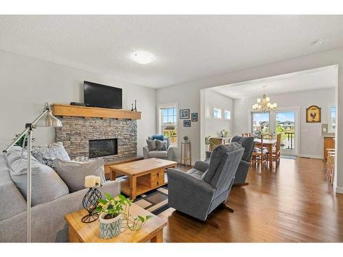130 Reunion Landing Nw, Airdrie, AB - Indoor Photo Showing Living Room With Fireplace
