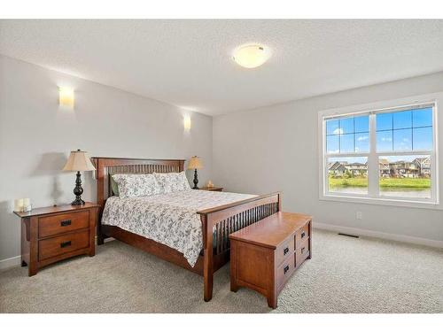 130 Reunion Landing Nw, Airdrie, AB - Indoor Photo Showing Bedroom