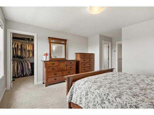 130 Reunion Landing Nw, Airdrie, AB - Indoor Photo Showing Bedroom