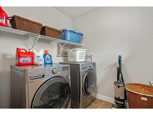 130 Reunion Landing Nw, Airdrie, AB - Indoor Photo Showing Laundry Room