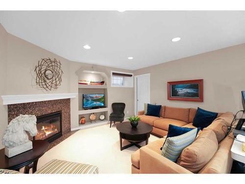 131 Chapalina Crescent Se, Calgary, AB - Indoor Photo Showing Living Room With Fireplace