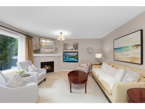 131 Chapalina Crescent Se, Calgary, AB - Indoor Photo Showing Living Room With Fireplace