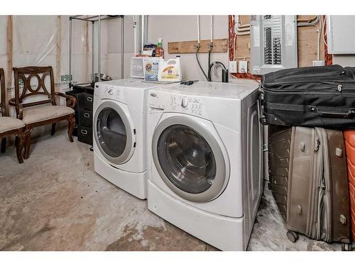 16 Cranston Gate Se, Calgary, AB - Indoor Photo Showing Laundry Room