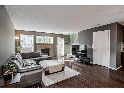 16 Cranston Gate Se, Calgary, AB - Indoor Photo Showing Living Room With Fireplace