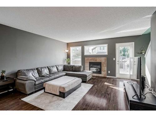 16 Cranston Gate Se, Calgary, AB - Indoor Photo Showing Living Room With Fireplace