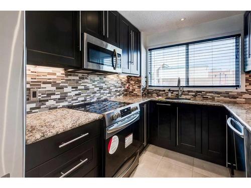 503-5660 23 Avenue Ne, Calgary, AB - Indoor Photo Showing Kitchen With Upgraded Kitchen