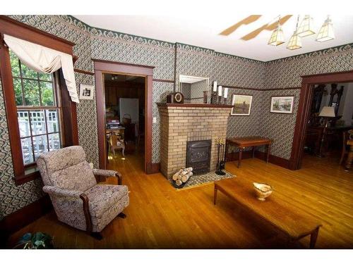 242030 Range Road 235, Rural Wheatland County, AB - Indoor Photo Showing Living Room With Fireplace