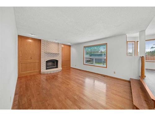 91 Macewan Meadow Way Nw, Calgary, AB - Indoor Photo Showing Living Room With Fireplace