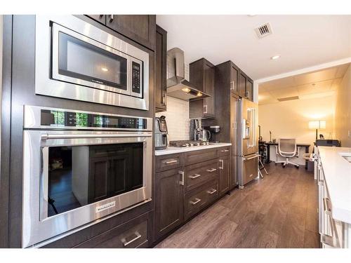 202-3320 3 Avenue Nw, Calgary, AB - Indoor Photo Showing Kitchen With Upgraded Kitchen