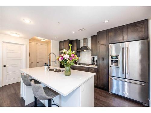 202-3320 3 Avenue Nw, Calgary, AB - Indoor Photo Showing Kitchen With Double Sink With Upgraded Kitchen