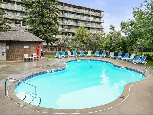 403-3316 Rideau Place Sw, Calgary, AB - Outdoor With In Ground Pool With Backyard