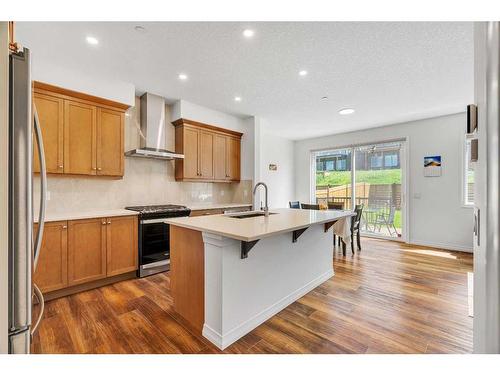 244 Lucas Way Nw, Calgary, AB - Indoor Photo Showing Kitchen With Stainless Steel Kitchen With Upgraded Kitchen