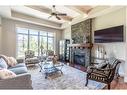 214 Artesia Gate, Heritage Pointe, AB  - Indoor Photo Showing Living Room With Fireplace 