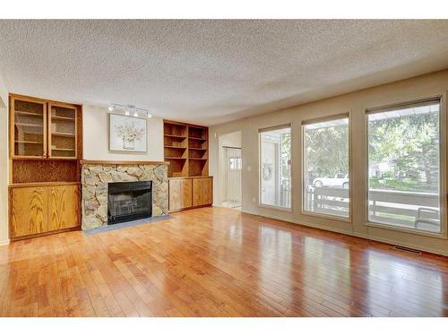 1511 22 Avenue Nw, Calgary, AB - Indoor Photo Showing Living Room With Fireplace