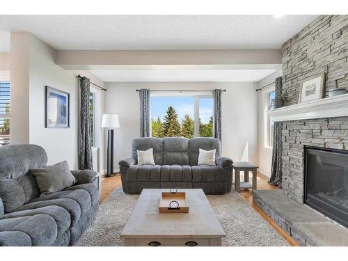 626 Hidden Vale Place Nw, Calgary, AB - Indoor Photo Showing Living Room With Fireplace