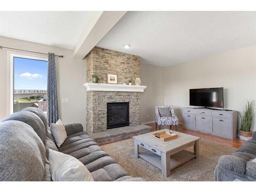 626 Hidden Vale Place Nw, Calgary, AB - Indoor Photo Showing Living Room With Fireplace