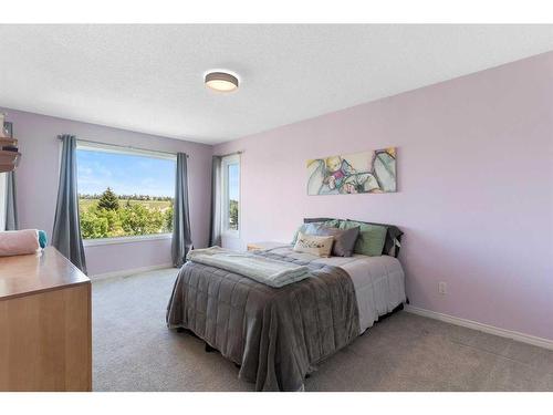 626 Hidden Vale Place Nw, Calgary, AB - Indoor Photo Showing Bedroom