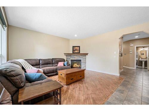 107 Cranwell Square Se, Calgary, AB - Indoor Photo Showing Living Room With Fireplace