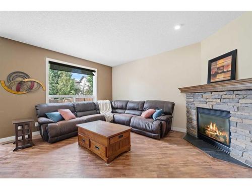107 Cranwell Square Se, Calgary, AB - Indoor Photo Showing Living Room With Fireplace