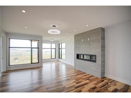 19 Red Willow Crescent West, Rural Foothills County, AB - Indoor With Fireplace